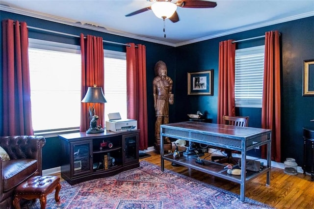 home office featuring a ceiling fan, wood finished floors, and ornamental molding