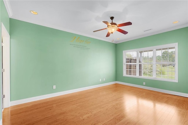 empty room with ceiling fan, light wood-type flooring, and crown molding