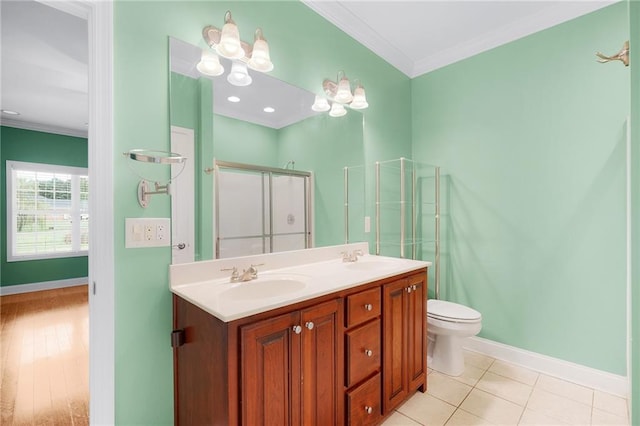 bathroom featuring tile patterned flooring, vanity, an enclosed shower, and crown molding