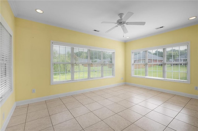 tiled empty room featuring ceiling fan and ornamental molding