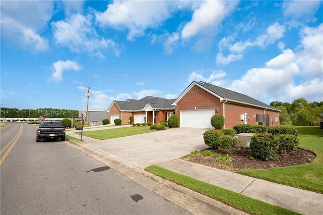 ranch-style home with a garage and a front yard