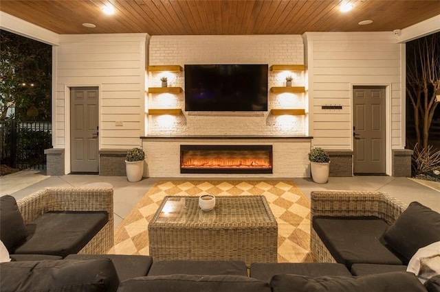 living room with a large fireplace, wood walls, and wooden ceiling