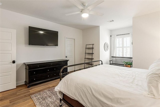 bedroom featuring hardwood / wood-style floors and ceiling fan