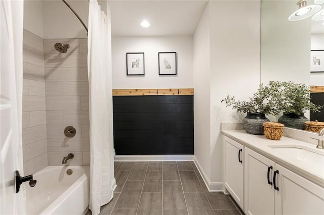 bathroom featuring shower / tub combo with curtain and vanity