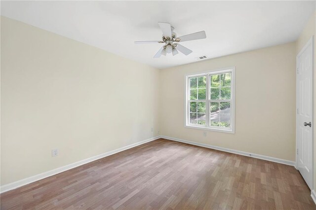 3684 Regent Dr NW, Kennesaw, GA 30144 - empty room featuring wood finished floors, baseboards, and ceiling fan