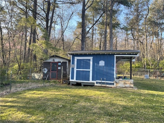 view of shed featuring fence