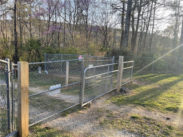 view of gate with fence