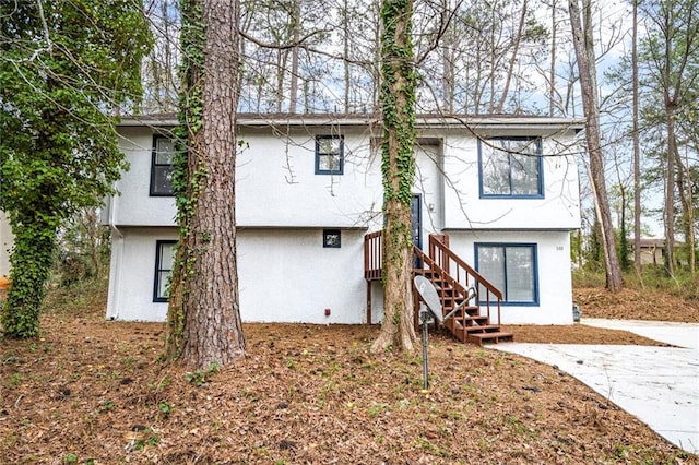 back of property with stucco siding