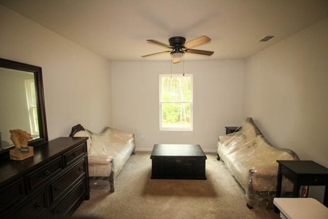 bedroom featuring baseboards, a ceiling fan, carpet flooring, and visible vents