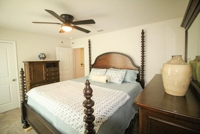 bedroom featuring ceiling fan and light colored carpet