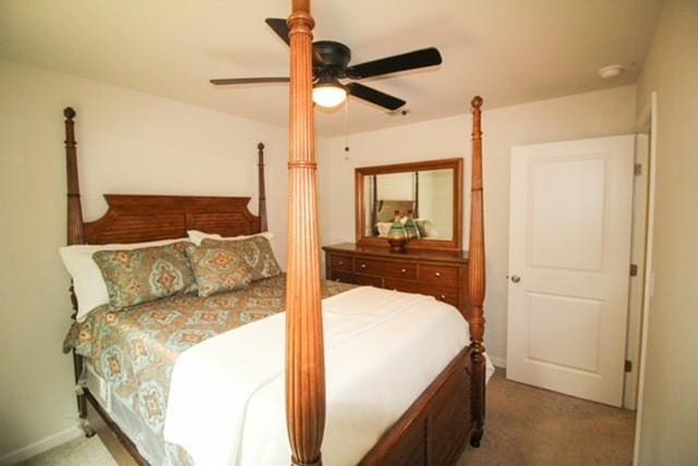 carpeted bedroom featuring a ceiling fan