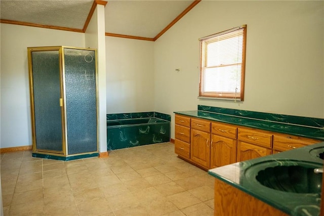 bathroom with tile patterned flooring, vaulted ceiling, shower with separate bathtub, vanity, and ornamental molding