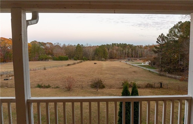 yard at dusk with a rural view