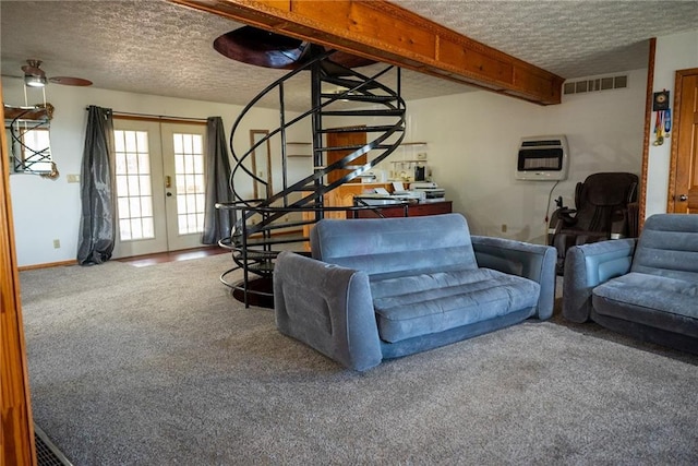 carpeted living room with french doors, a textured ceiling, heating unit, and ceiling fan