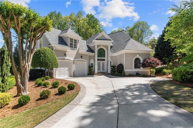 view of front of home featuring a garage and french doors