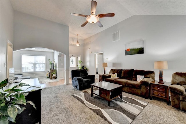 living room featuring carpet, high vaulted ceiling, and ceiling fan