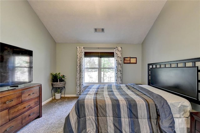 carpeted bedroom with vaulted ceiling