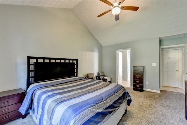 carpeted bedroom featuring vaulted ceiling and ceiling fan