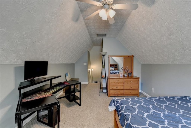 bedroom with carpet, ceiling fan, a textured ceiling, and lofted ceiling