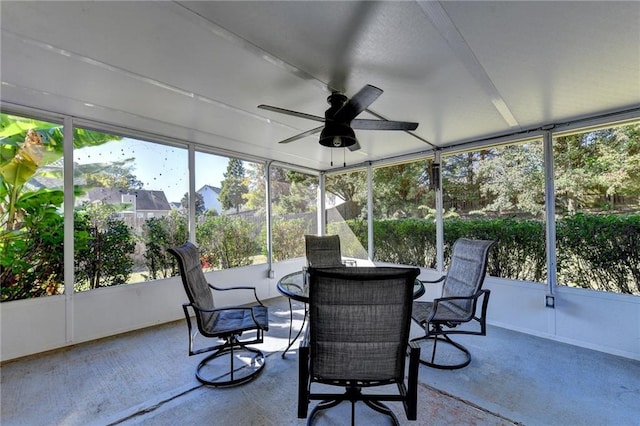 sunroom / solarium featuring ceiling fan