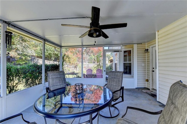 sunroom / solarium featuring a wealth of natural light and ceiling fan