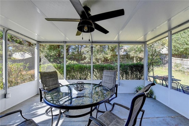 sunroom / solarium with a healthy amount of sunlight and ceiling fan