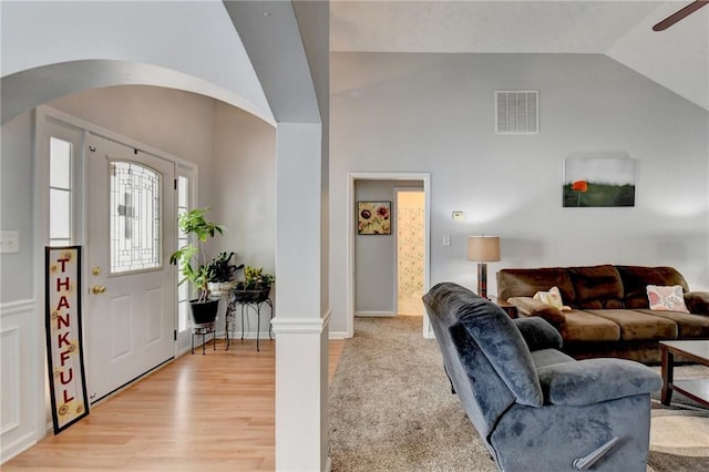 entrance foyer featuring vaulted ceiling, light hardwood / wood-style flooring, and ceiling fan