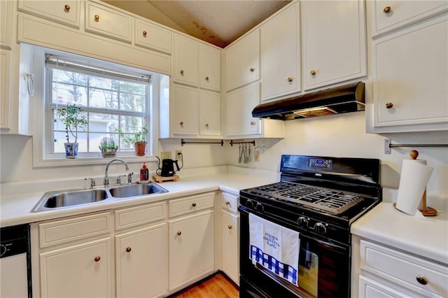 kitchen featuring black gas range, white dishwasher, under cabinet range hood, white cabinetry, and a sink