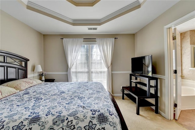 bedroom featuring a raised ceiling, light colored carpet, visible vents, ornamental molding, and baseboards