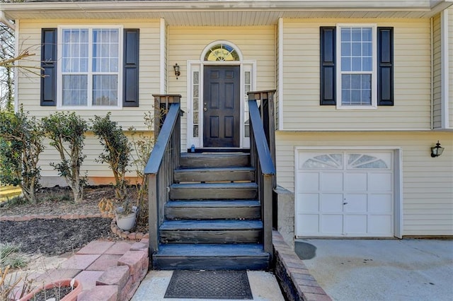 doorway to property featuring a garage