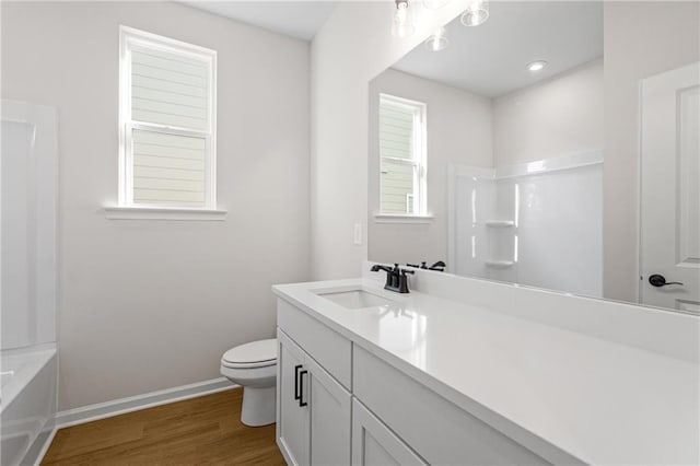 full bath with vanity, toilet, baseboards, and wood finished floors