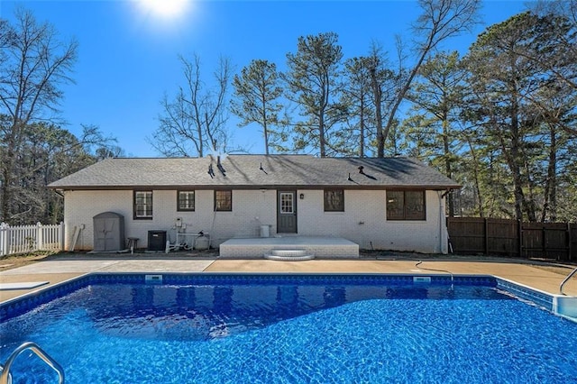 view of pool featuring a patio area and central AC