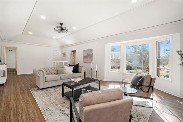 living room with vaulted ceiling and hardwood / wood-style floors