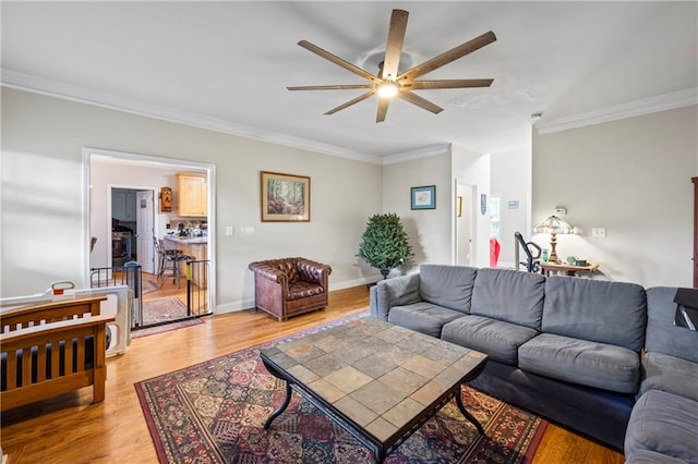 38 Olde Wick Trl, Hoschton, GA 30548 - living area featuring ceiling fan, crown molding, and light wood finished floors