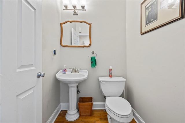 38 Olde Wick Trl, Hoschton, GA 30548 - half bathroom featuring toilet and wood finished floors