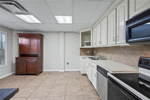 38 Olde Wick Trl, Hoschton, GA 30548 - kitchen featuring black appliances, tasteful backsplash, a drop ceiling, light countertops, and light tile patterned floors