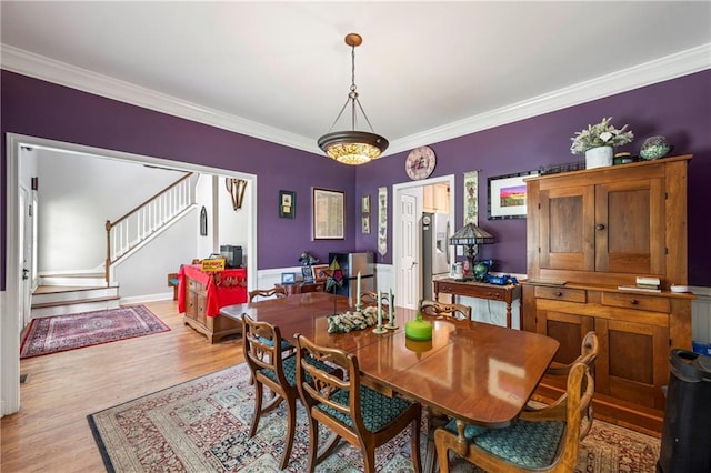 38 Olde Wick Trl, Hoschton, GA 30548 - dining space with crown molding, stairway, and light wood-type flooring