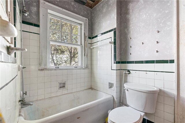 1225 Clifton Rd, Atlanta, GA 30307 - bathroom with a tub to relax in, tile walls, and toilet