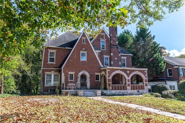 1225 Clifton Rd, Atlanta, GA 30307 - tudor-style house featuring a porch