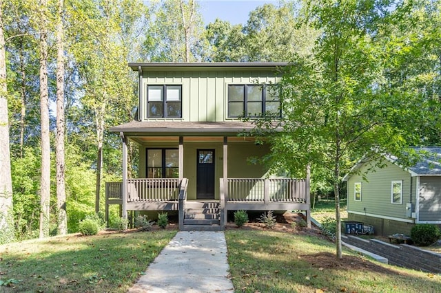 view of front of house featuring a front yard and a porch