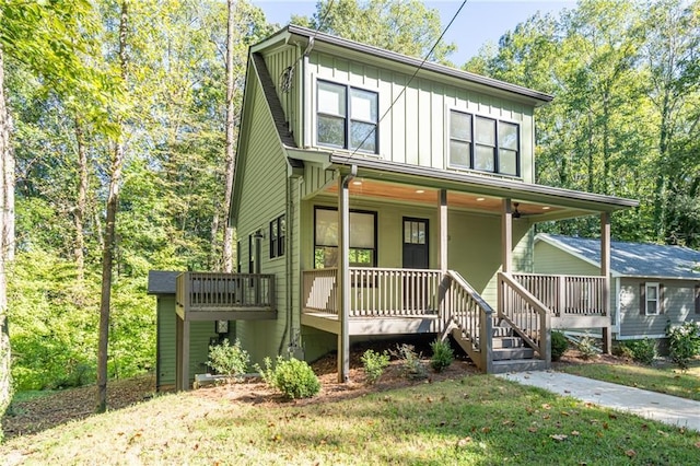 view of front of house with a front lawn and a porch