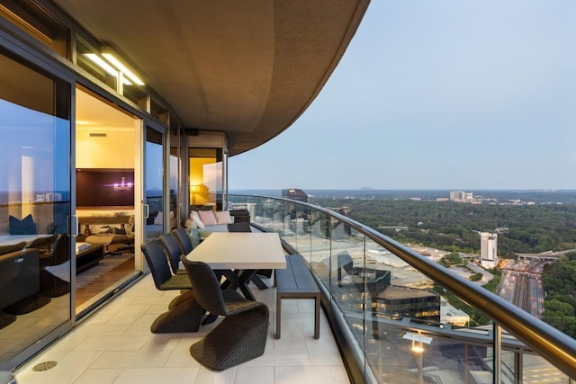 balcony with a view of city and visible vents