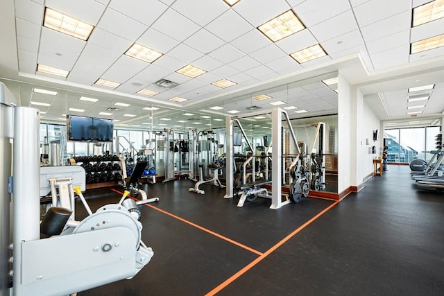 workout area featuring a paneled ceiling and visible vents
