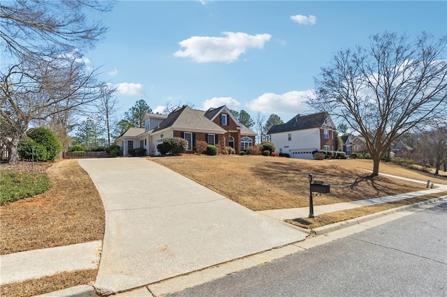 view of front of property with a front yard and driveway