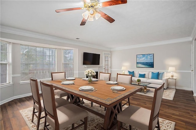 dining room featuring crown molding, ceiling fan, and dark hardwood / wood-style floors