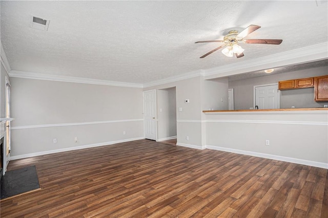 unfurnished living room with ceiling fan, dark wood-type flooring, a textured ceiling, and ornamental molding