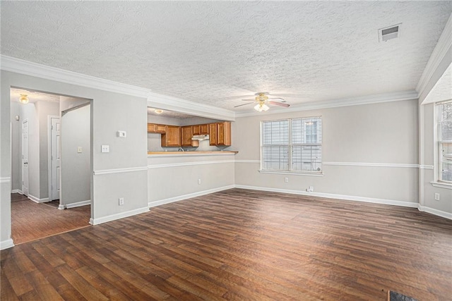 unfurnished living room featuring a textured ceiling, ceiling fan, dark hardwood / wood-style floors, and ornamental molding