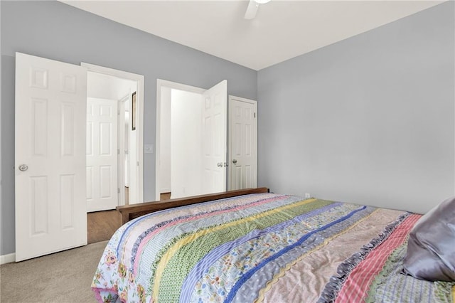 carpeted bedroom with ceiling fan