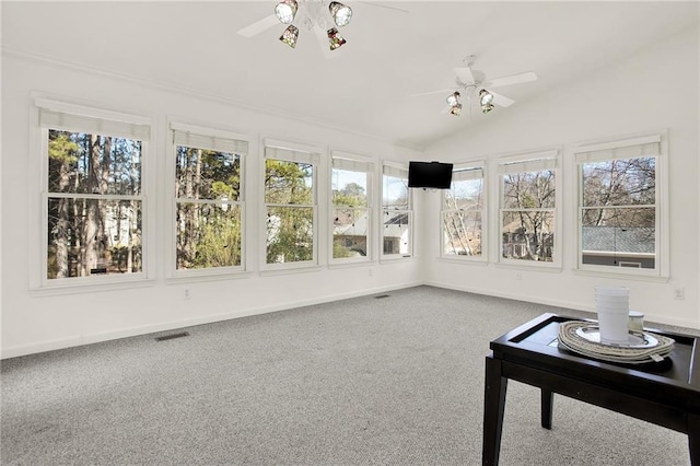 sunroom with ceiling fan and lofted ceiling