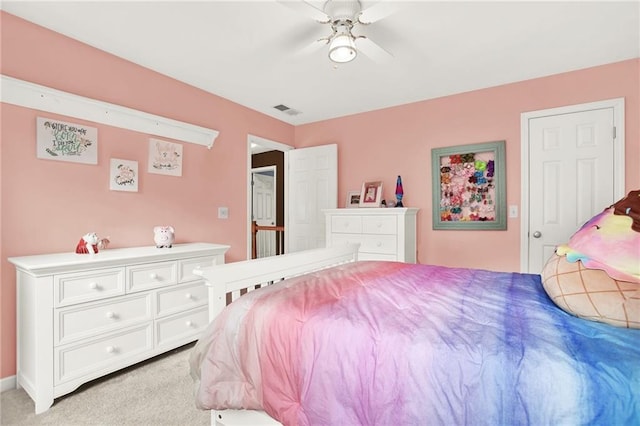 carpeted bedroom with ceiling fan